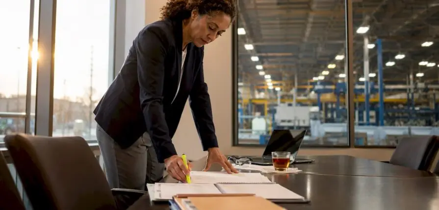 Facility manager reviewing maintenance schedules