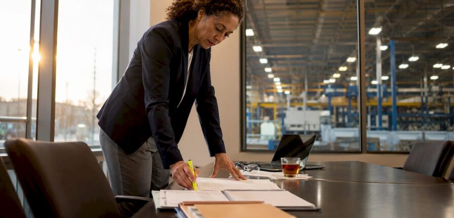 Facility manager reviewing maintenance schedules