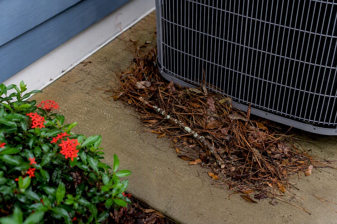 Storm debris blocking outdoor condenser airflow