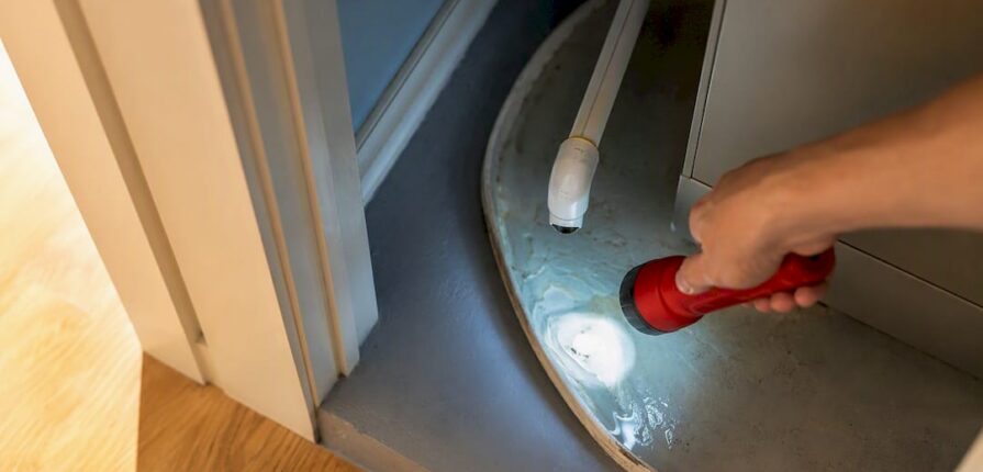 Standing water in an AC condensate drain pan